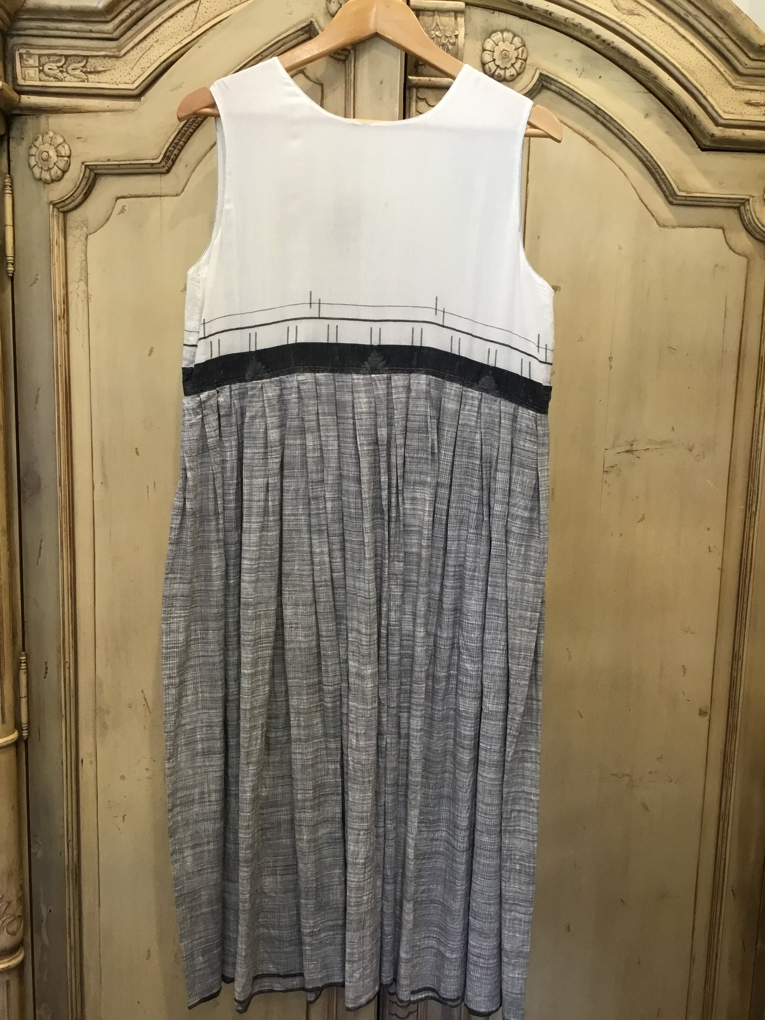Easy to wear midi length  fine handloomed day  dress with scooped neck and fiine charcoal geometric on soft white bodice. 