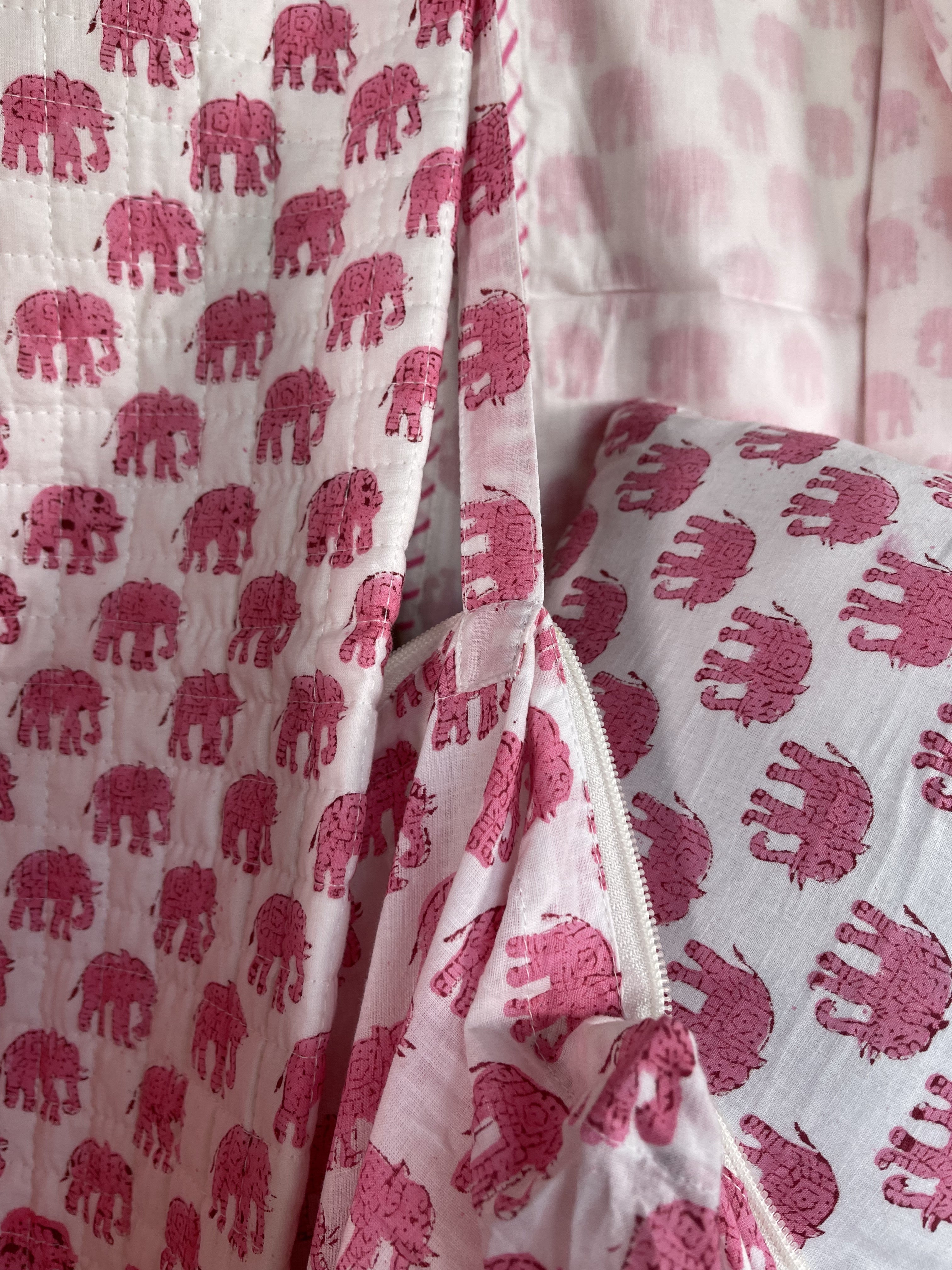 Handblock printed cotton baby quilt, machine stitched in small squares for easy care and washing. Lightly padded with cotton.