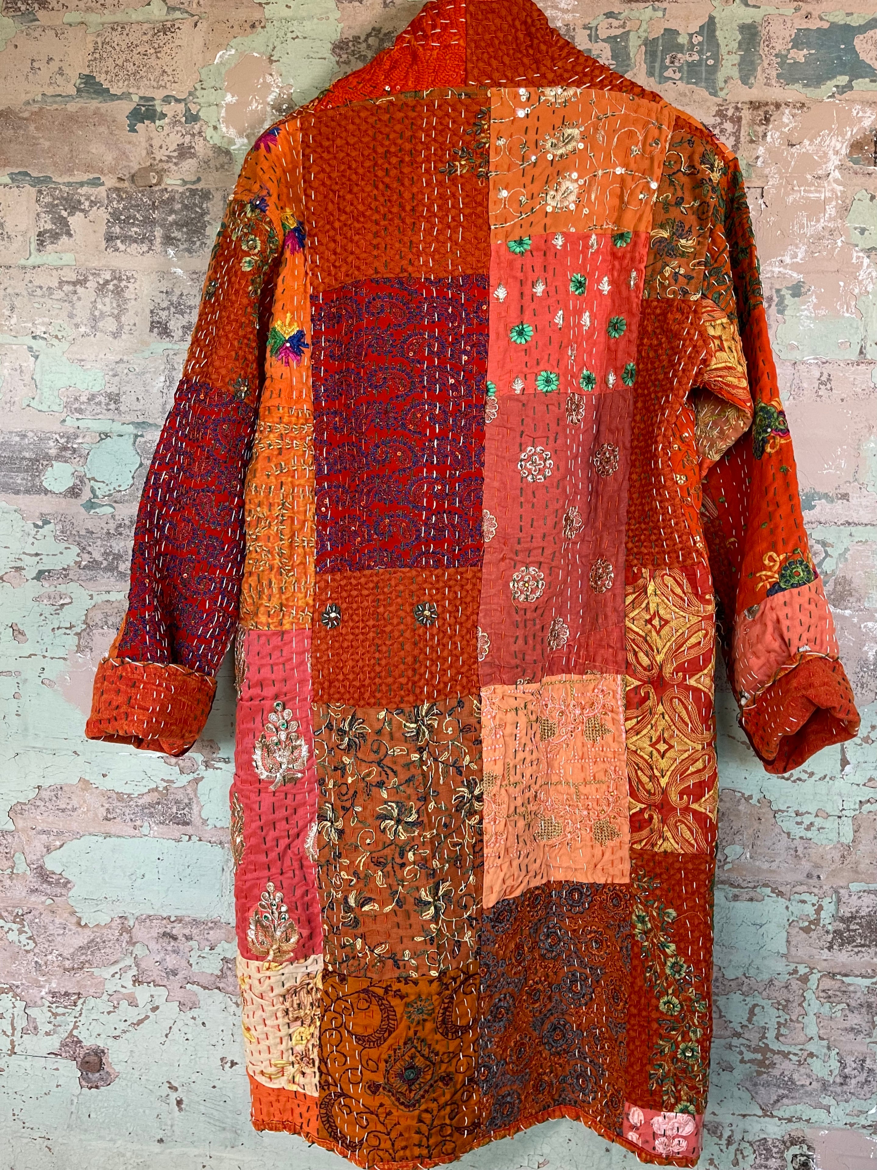Delightful kantha coat in patchwork of embroidered patterns and sequins. The inside lining plain.