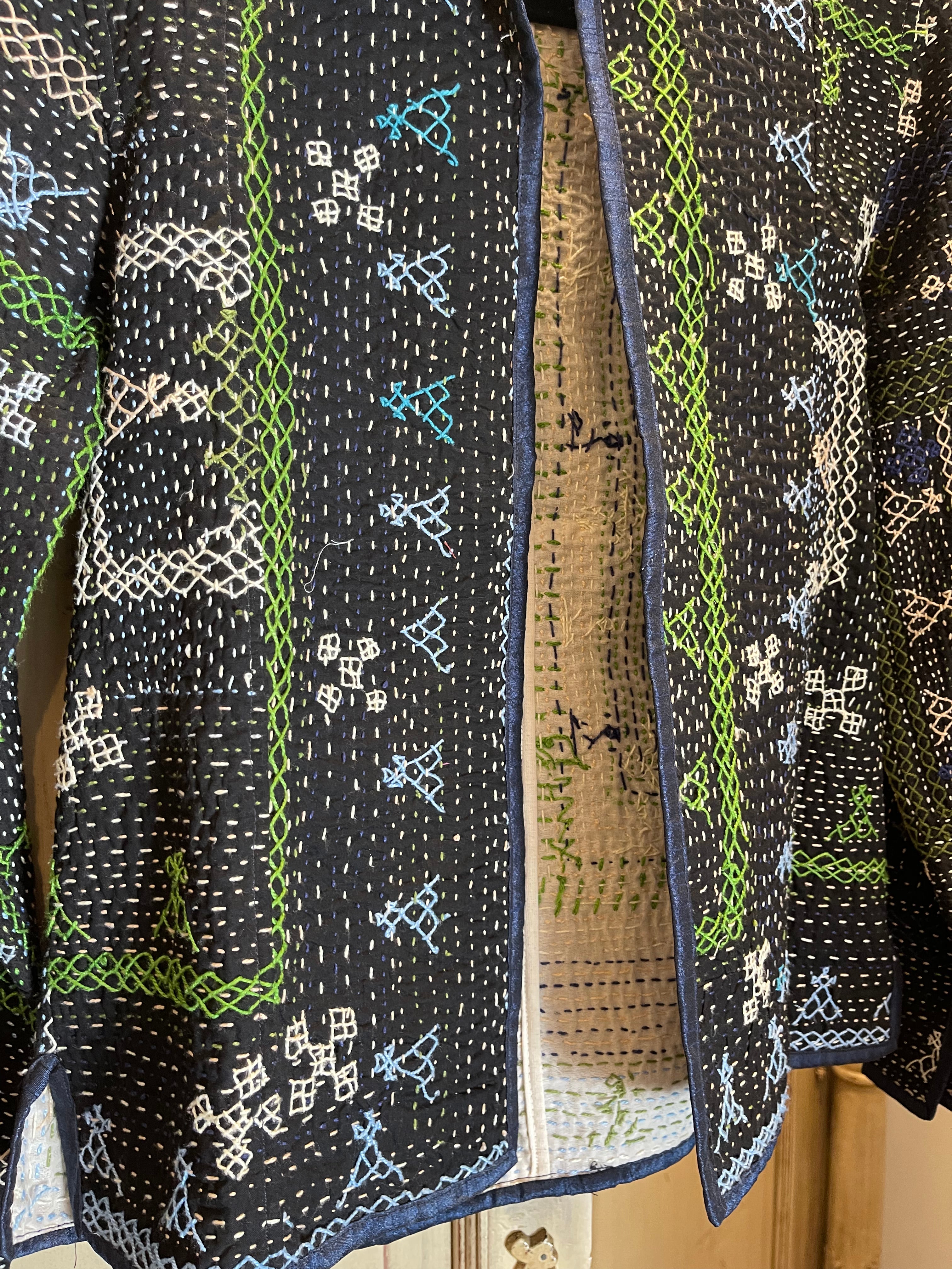 Vintage Saami kantha cropped jacket with long sleeves. This simple round neck cropped jacket has been fashioned from vintage snake charmer quilts. 