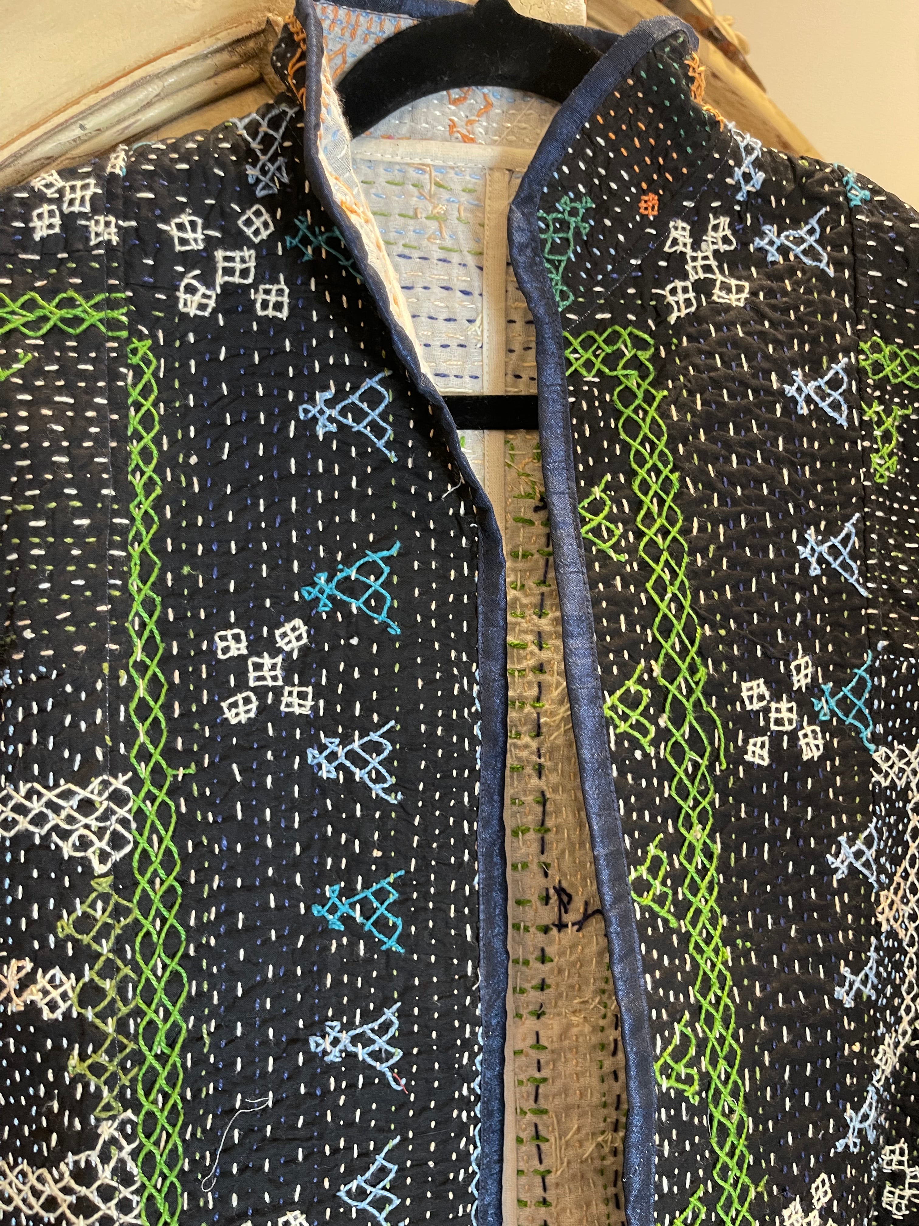Vintage Saami kantha cropped jacket with long sleeves. This simple round neck cropped jacket has been fashioned from vintage snake charmer quilts. 
