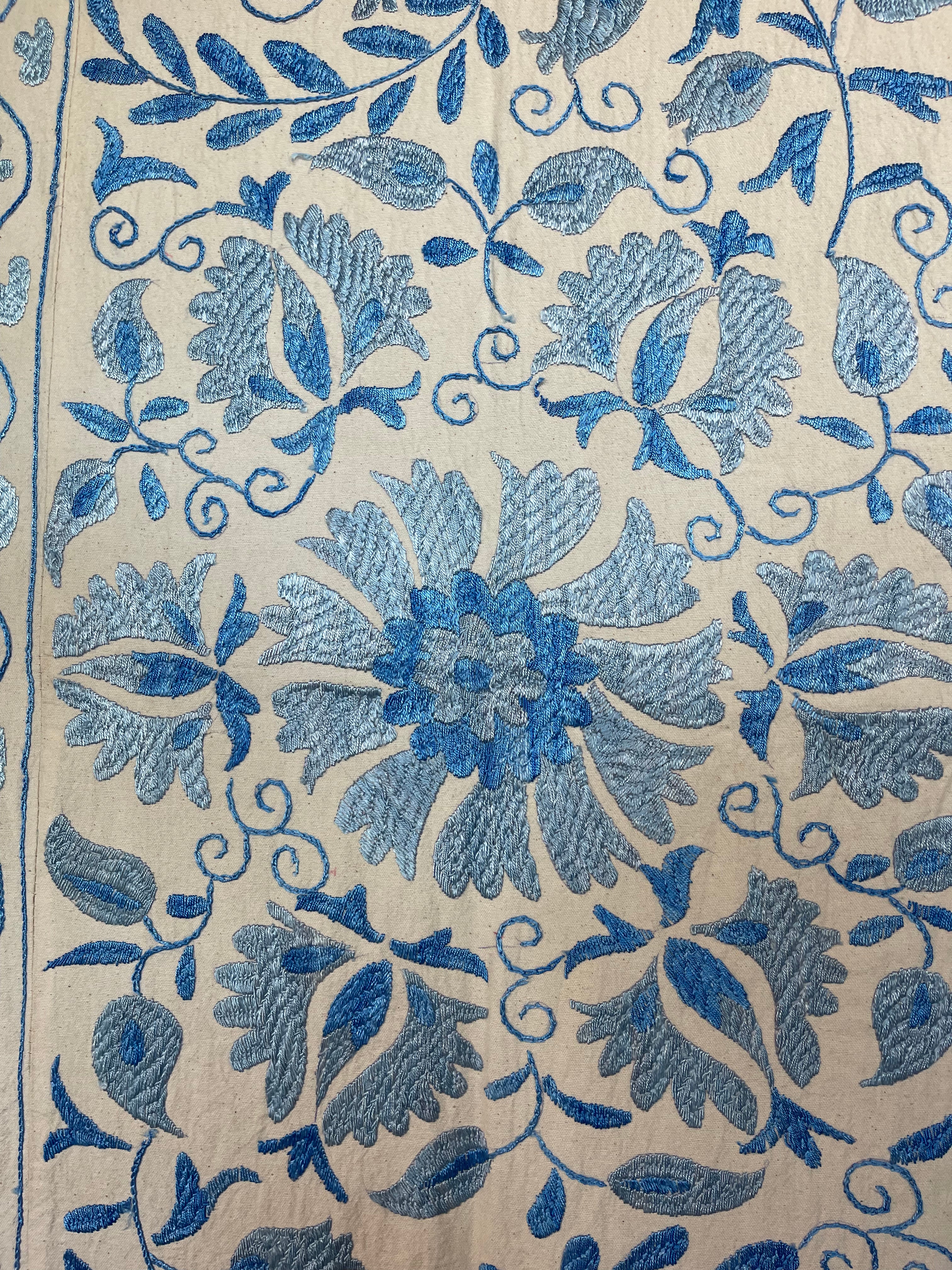 Hand embroidered blue vines suzani on beautifully weighted natural coloured cotton.