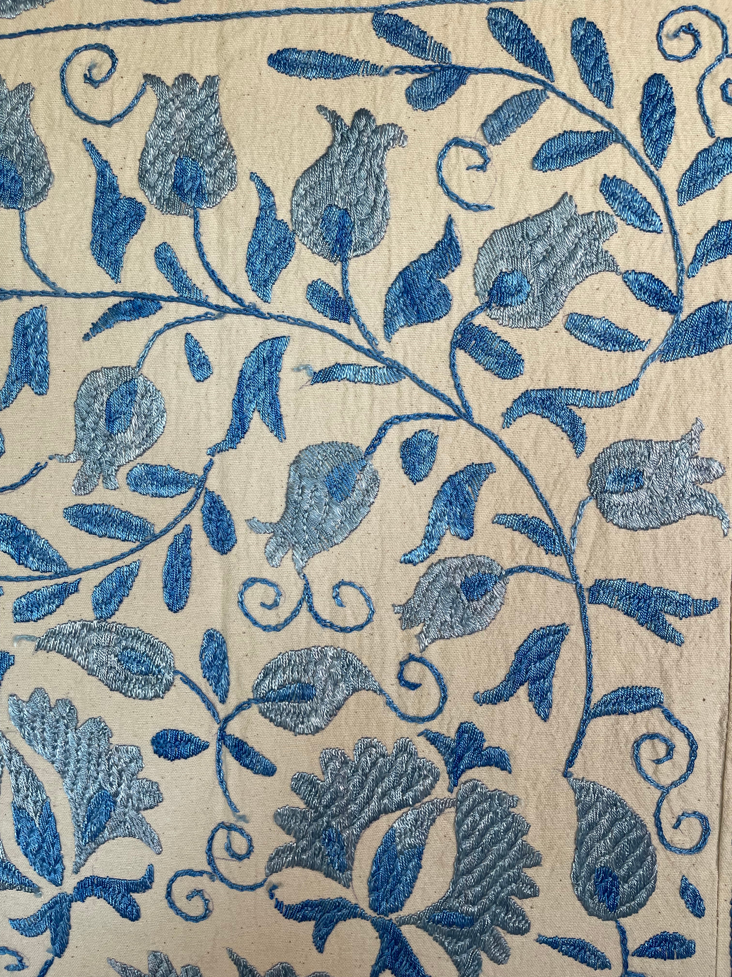 Hand embroidered blue vines suzani on beautifully weighted natural coloured cotton.